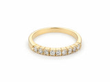 ArtGold 18K yellow gold half eternity band set with nine round diamonds in a single row, front view of the shared-prong setting and polished band