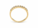 ArtGold 18K yellow gold half eternity diamond band, upright view of the nine round diamonds in their shared-prong setting