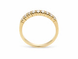 ArtGold 18K yellow gold half eternity diamond band standing upright, showing the polished band and the diamond row