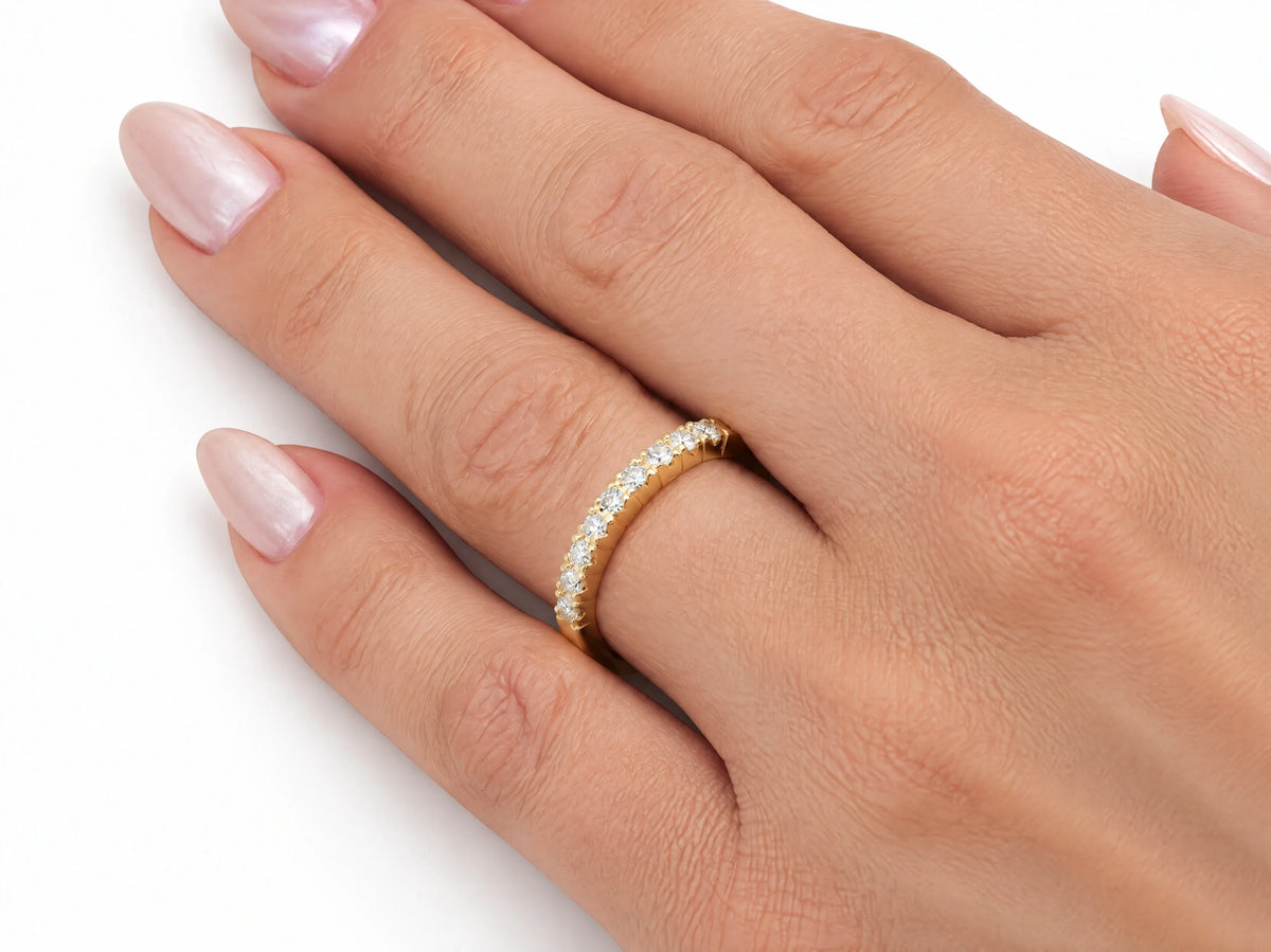 ArtGold 18K yellow gold half eternity diamond band worn on the finger