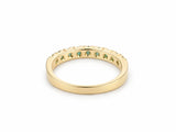 ArtGold 18K yellow gold half eternity emerald band, side profile of the band and the shared-prong setting