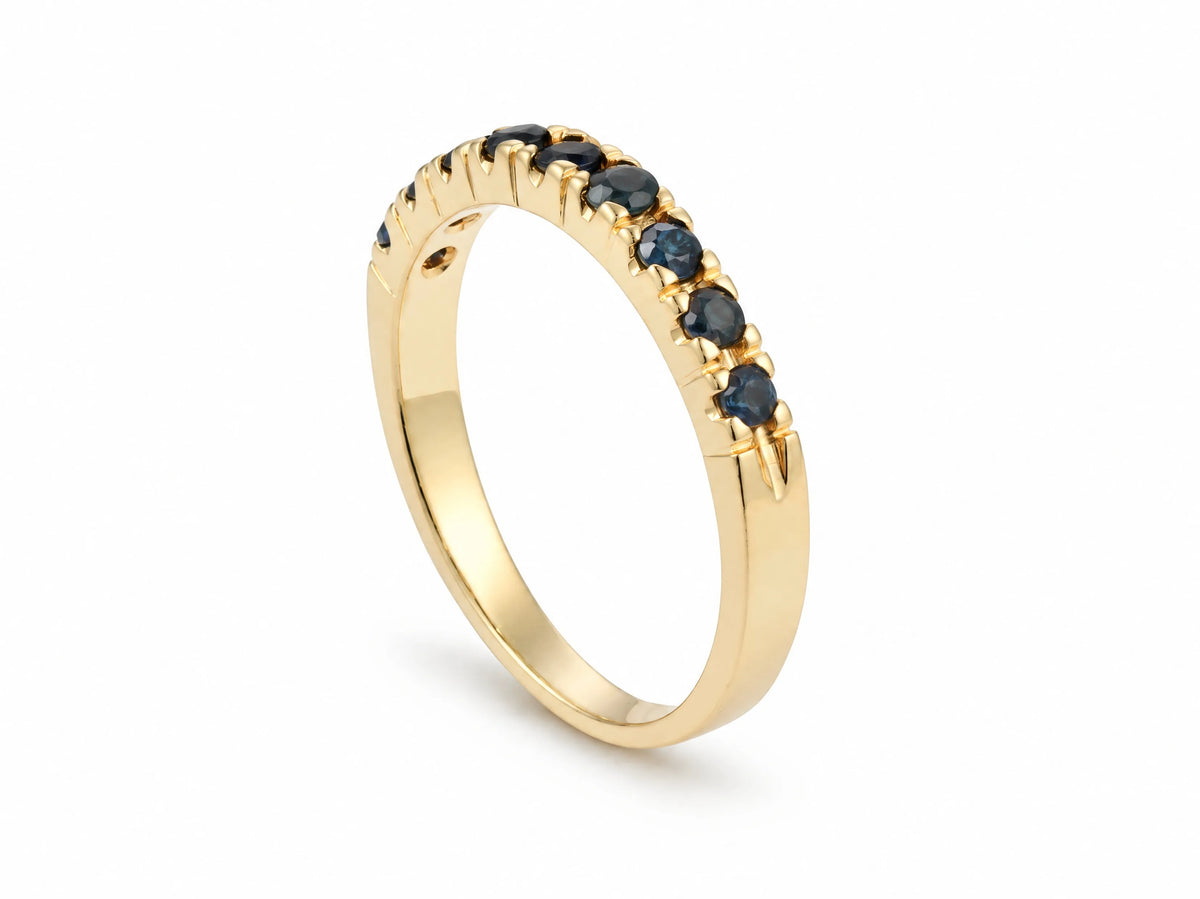 ArtGold 18K yellow gold half eternity sapphire band standing upright, showing the polished band and the sapphire row