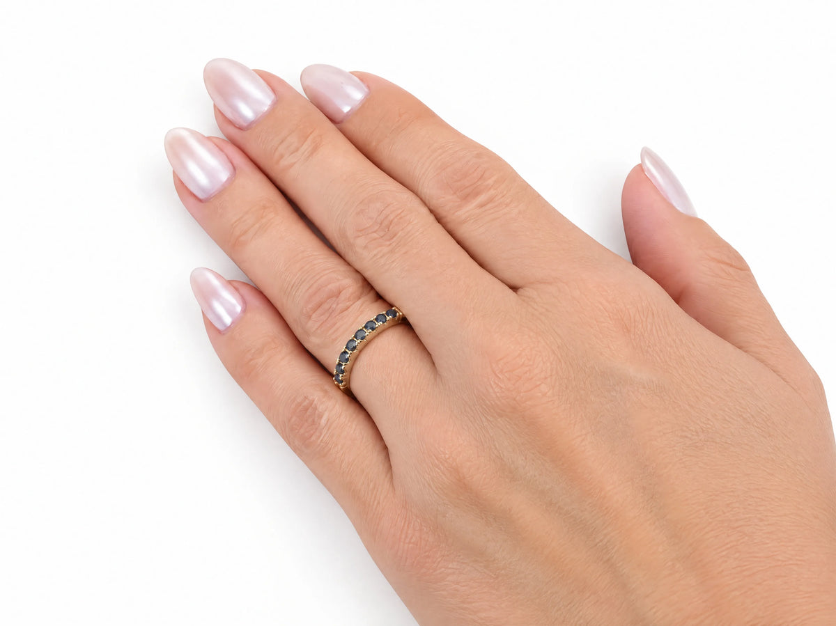 ArtGold 18K yellow gold half eternity sapphire band worn on the finger