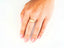 Yellow gold heart ring with diamond-cut 18k elongated oval signet face and intricate design