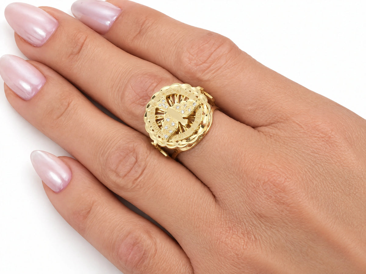 ArtGold exclusive 18K yellow gold Holy Spirit diamond ring worn on the finger, close view of the diamond-set dove medallion
