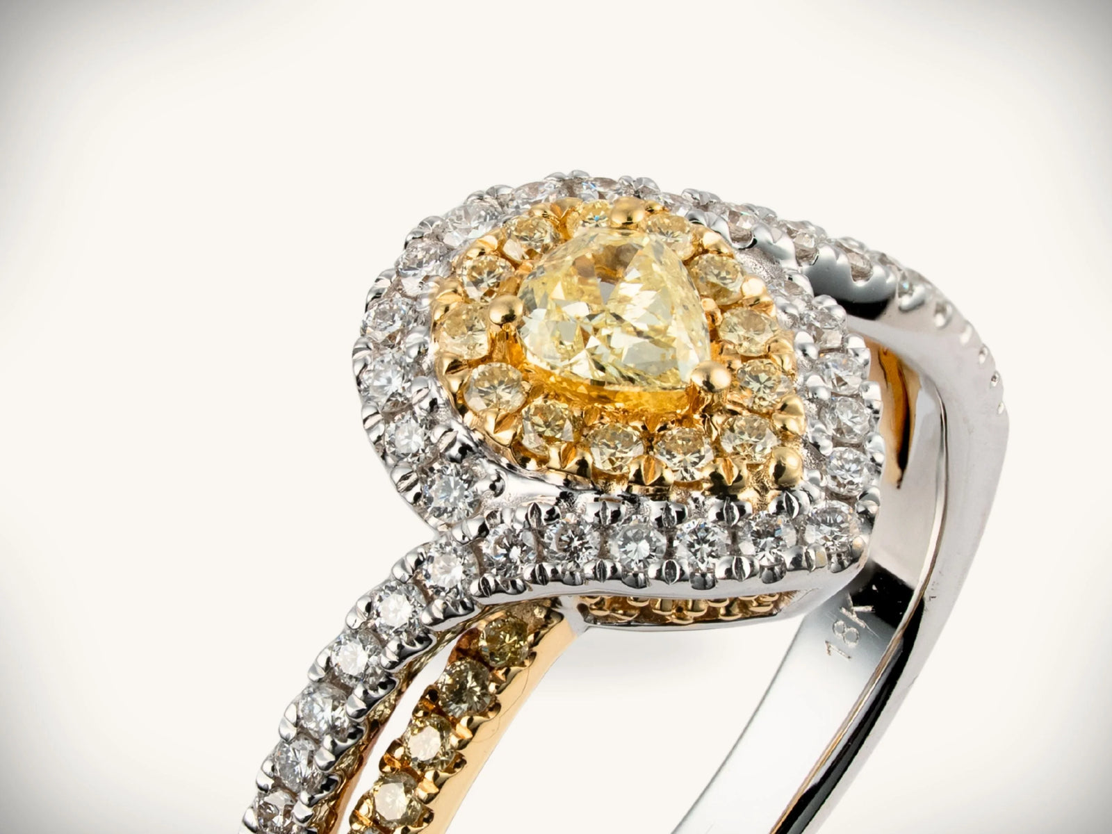 18K yellow gold diamond halo ring with 0.69ctw yellow heart diamond