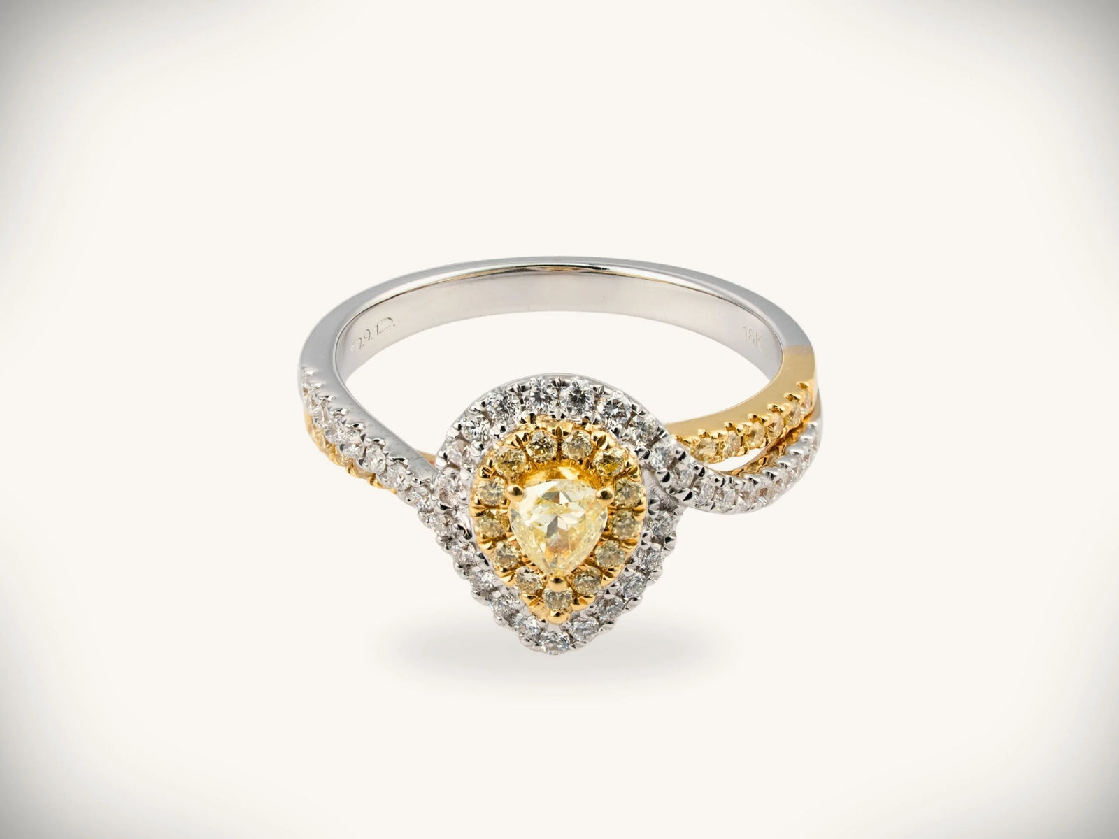 18K yellow gold diamond halo ring with 0.69ctw yellow pear diamond