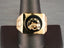 Gold signet ring with onix horse shoes and horse shoe motif on black oval face