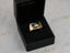 Gold ring with black rectangular top and horse shoe motif from 18kg Onix Horse collection