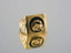 Gold signet ring with onix horse shoes motif featuring a black inlay and horse head design