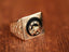 Gold men’s ring with black onix horse shoes inlay and horse shoe motif design