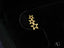 Gold star-shaped earrings from 3 Stars Earrings collection in certified 18k solid gold jewelry