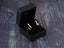 Gold star earrings in a black box, showcasing certified 18k solid stars ear climber design