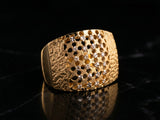 Malha diamond-cut ring in 18K gold — honeycomb lattice on dark luxury background