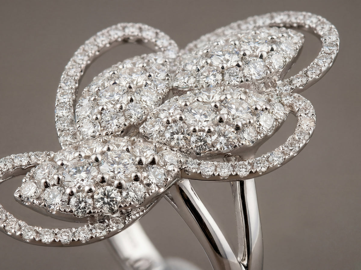 Close-up of 18K white gold diamond statement ring craftsmanship - ArtGold Jewelry