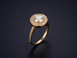 Estrela halo engagement ring in 18K gold — 1.05ct GIA diamond on dark luxury background