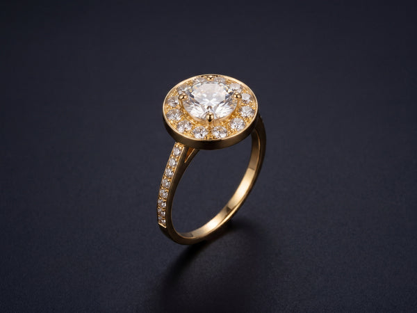 Estrela halo engagement ring in 18K gold — 1.05ct GIA diamond on dark luxury background
