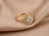 Estrela halo ring in 18K yellow gold on champagne silk — split-cathedral shoulders
