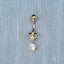 18k Gold Bellybutton Piercing with Cubic Zirconia and Star Charm on Gray Background