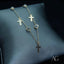 18k gold anklet with cross charms, showcasing elegance and spirituality.