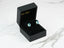 Blue gemstone stud earrings in a black jewelry box, Azure Embrace Earrings with Oval Blue Topaz
