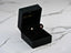Heart-shaped pink CZ heart stud earrings in a black jewelry box for Blush Love