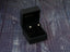 Star earrings displayed in a black jewelry box, featuring art gold jewelry design