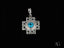 Silver cross pendant in 18k white gold featuring blue topaz and star cutout designs