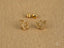Dazzling 18k yellow gold star earrings with clear gemstones for a celestial look
