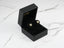 Gold and turquoise stud earrings in a black jewelry box for Celestial Glow collection