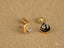 Pair of heart-shaped stud earrings from Celestial Love, crafted in 18K gold moon design