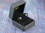 Silver stud earrings in a gray jewelry box for Celestial Love – 18K Gold Moon Jewelry