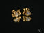 Gold CZ heart bow earrings featuring triangular diamond accents in elegant design