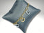 Charm bracelet with heart-shaped pendants in 18K art gold and white gold on gray cushion