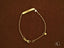 Delicate gold personalized ID bracelet with heart motif charm and lobster lock