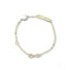 Children’s ID bracelet in yellow gold featuring a white gold heart motif and delicate beads
