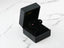 Black jewelry box showcasing Crimson Radiance 18k White Gold CZ Stud Earrings with rubies