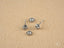 Four silver stud earrings from Crown Jewel featuring certified 18K solid gold and CZ