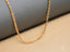 Delicate 18K Gold Chain Necklace showcasing art gold jewelry craftsmanship
