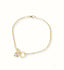 Delicate Charm 18k gold bracelet with zirconia heart and ring design.