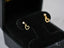 Gold CZ heart drop earrings featuring diamond studs and an elegant open-heart charm