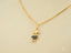 18k Gold Dual Elegance Pendant with Penguin-Shaped Blue Crystal Details