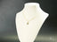 Gold 18k necklace featuring the elegant Dual Elegance Pendant on a jewelry bust