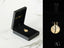 Gold-toned Dual Harmony Two Faces Pendant in a black jewelry box, 18k gold design