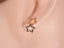 Ear showcasing Dual Star Earrings in certified 18k solid Art Gold Jewelry