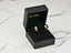 Eclipse Elegance 18K Gold Black and White Pearl Earrings in a luxurious black jewelry box