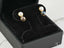 Eclipse Elegance 18K Gold Black and White Pearl Earrings showcasing timeless beauty