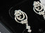 Silver floral-motif earrings in Elegant 18K Diamond Earrings – Floral Design, certified 18K solid