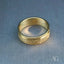 Elegant 18k gold diamond wedding band for her on a soft background, showcasing timeless design and luxurious craftsmanship.