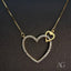18k gold heart necklace adorned with zirconia from Art Gold Jewelry.